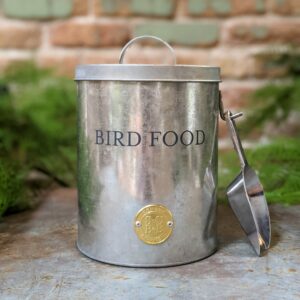 Bird food storage container made of galvanized tin with a scoop and Bird Food written across the front