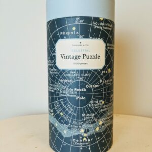 Tube decorated with vintage illustrations of constellations with a blue top
